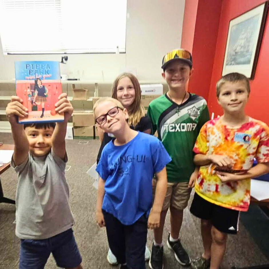 Kids participating in the Pippa Park Escape Room Activity at the Bonham Public Library
