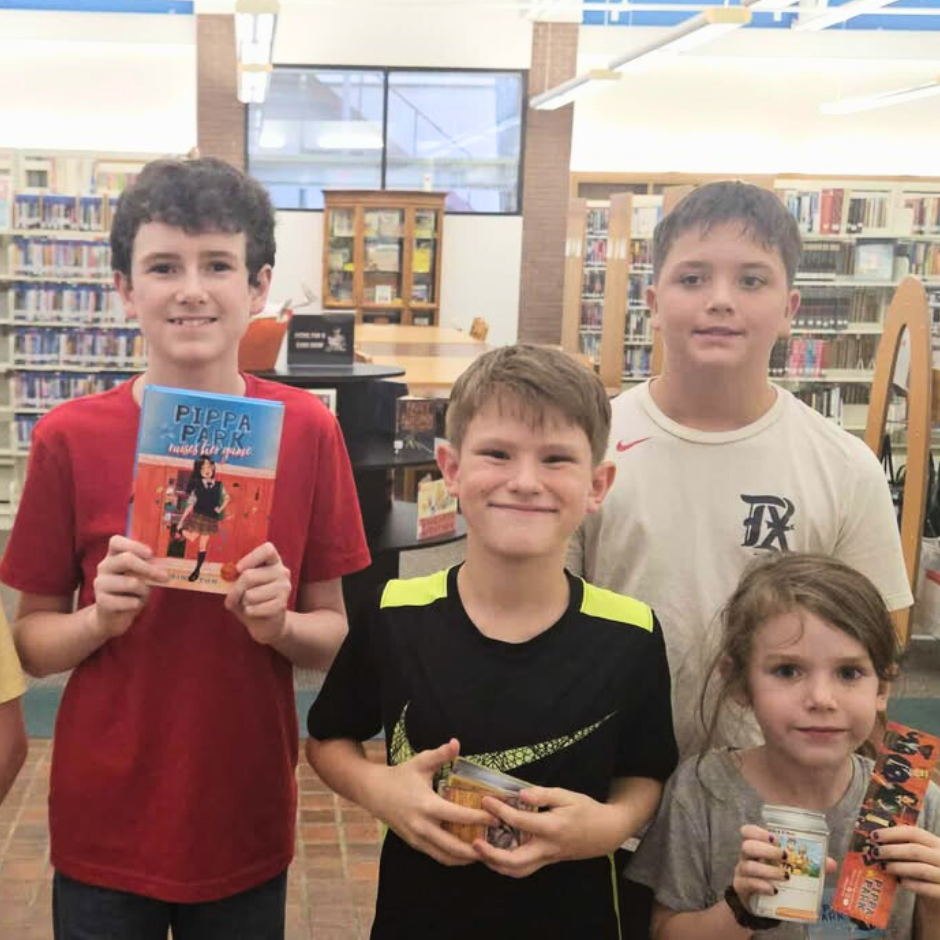 Kids participating in the Pippa Park Escape Room Activity at the Bonham Public Library
