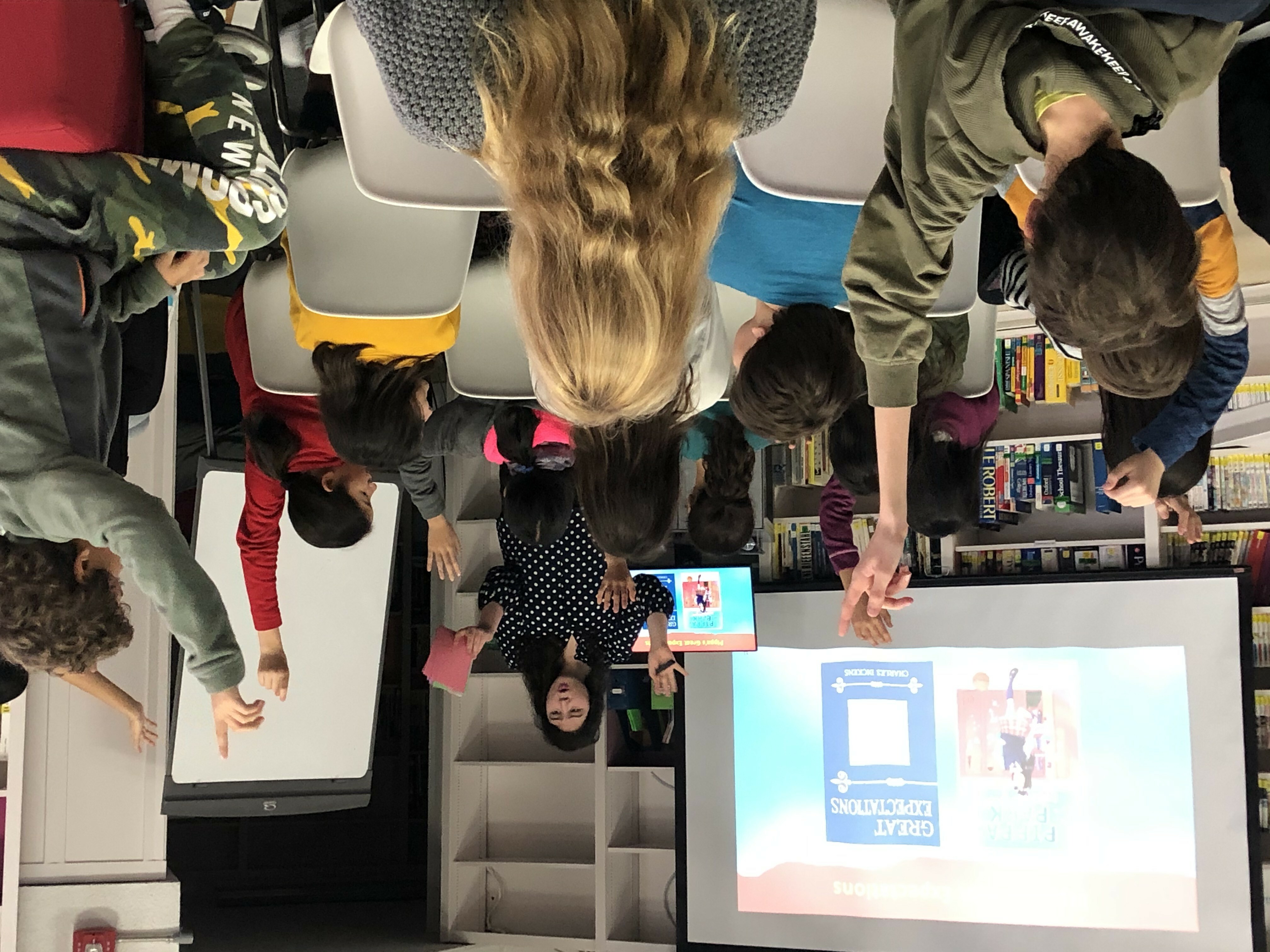 Author Erin Yun givers her author presentation to a room of students sitting in chairs