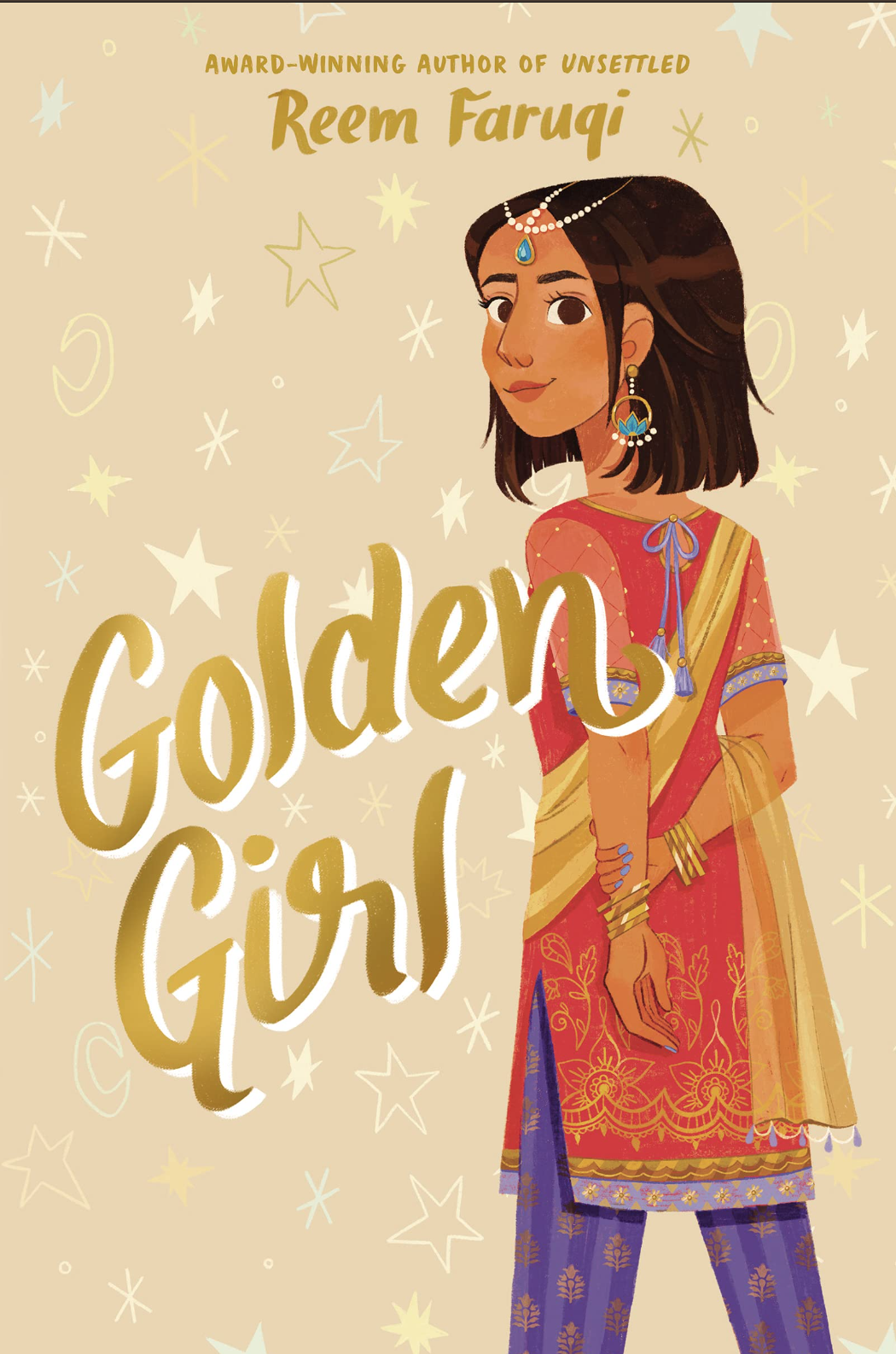 Aafiyah Qamar, a Pakistani-American girl, is holding her left arm behind her with her right arm and looking towards the bookÃ¢â‚¬â„¢s title. Written in a golden marker font, the tile reads Ã¢â‚¬Å“Golden GirlÃ¢â‚¬Â in front of a gold background with hand drawn stars and moons. 